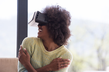 Image showing black woman using VR headset glasses of virtual reality