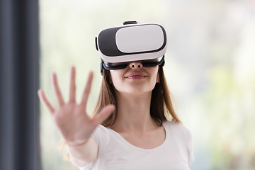 Image showing woman using VR-headset glasses of virtual reality