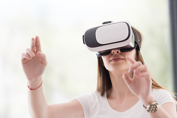 Image showing woman using VR-headset glasses of virtual reality