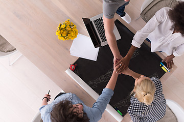 Image showing top view of Multiethnic startup business team on meeting