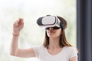 Image showing woman using VR-headset glasses of virtual reality