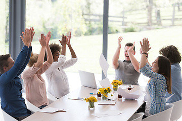 Image showing multiethnic startup Group of young business people throwing docu