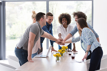 Image showing multiethnic startup Group of young business people celebrating s