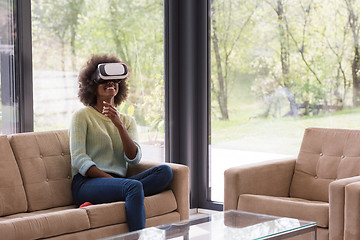 Image showing black woman using VR headset glasses of virtual reality