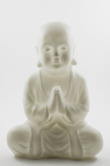 Image showing plastic small buddha sculpture on white