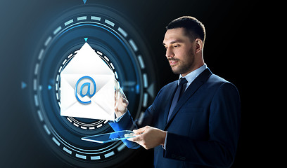 Image showing businessman with tablet pc and e-mail hologram