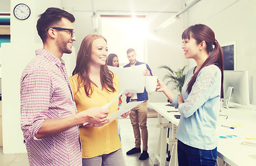 Image showing creative team on coffee break talking at office