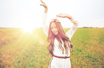 Image showing smiling young hippie woman on cereal field