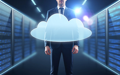 Image showing businessman in suit with virtual cloud hologram