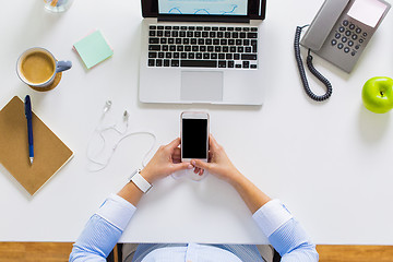 Image showing businesswoman with laptop and smartphone at office