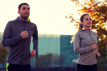 Image showing couple running outdoors