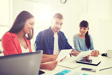 Image showing happy creative team or students working at office