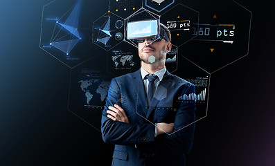 Image showing businessman in virtual reality headset over black