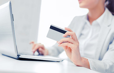 Image showing businesswoman with laptop and credit card