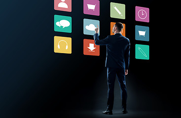 Image showing businessman in suit touching virtual menu icons