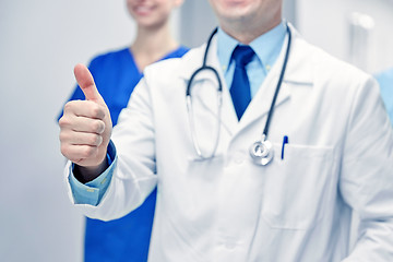 Image showing close up of doctors at hospital showing thumbs