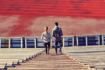 Image showing couple walking downstairs on stadium