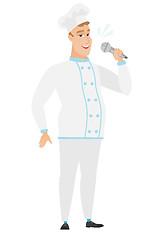 Image showing Caucasian chef cook singing to the microphone.