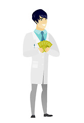 Image showing Happy asian doctor holding money.