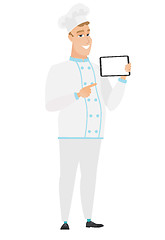 Image showing Smiling chef cook holding tablet computer.