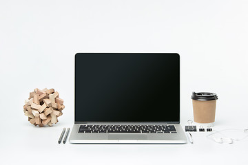 Image showing The front view of notebook and cup of coffee. Inspiration and mock-up concept