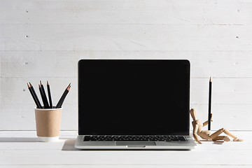 Image showing The front view of notebook and cup of coffee. Inspiration and mock-up concept