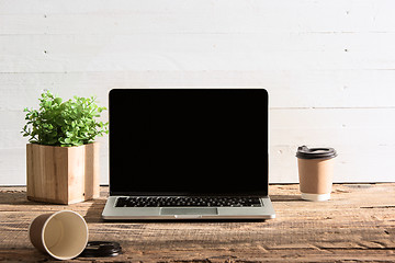 Image showing The front view of notebook and cup of coffee. Inspiration and mock-up concept