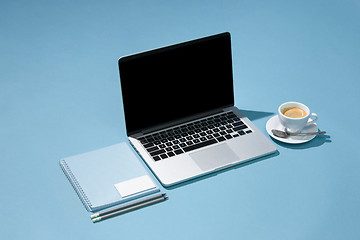 Image showing The laptop, pens, phone, note with blank screen on table