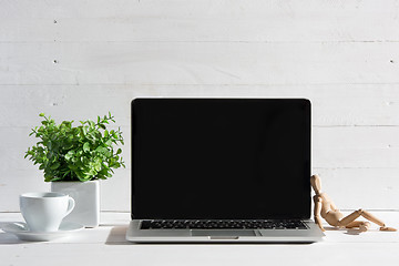 Image showing The front view of notebook and cup of coffee. Inspiration and mock-up concept