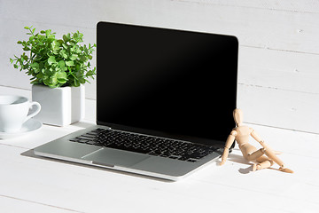 Image showing The front view of notebook and cup of coffee. Inspiration and mock-up concept