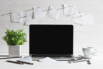 Image showing The front view of notebook and cup of coffee. Inspiration and mock-up concept