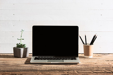 Image showing The front view of notebook and cup of coffee. Inspiration and mock-up concept