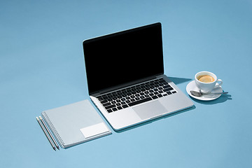 Image showing The laptop, pens, phone, note with blank screen on table