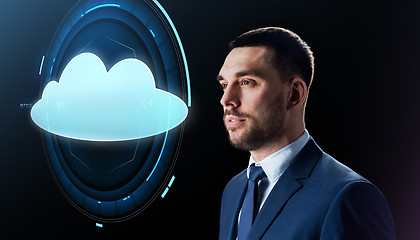 Image showing businessman over black with cloud projection