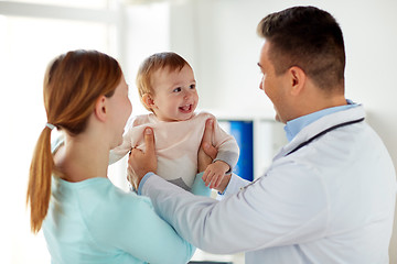 Image showing happy woman with baby and doctor at clinic