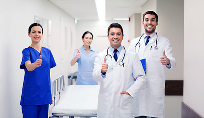 Image showing happy doctors showing thumbs up at hospital