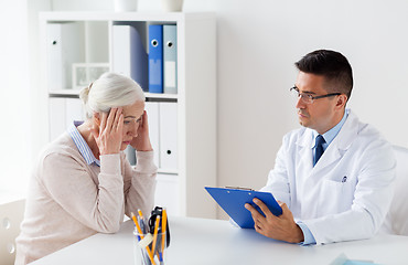 Image showing senior woman and doctor meeting at hospital