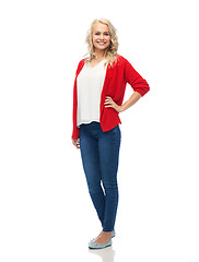 Image showing happy smiling young woman in red cardigan