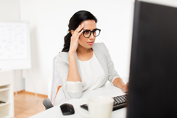 Image showing businesswoman with computer working at office