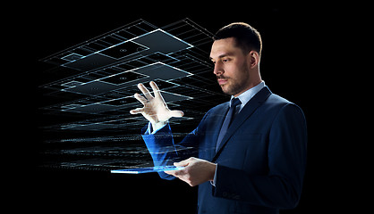 Image showing businessman with tablet pc and virtual building