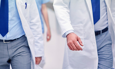 Image showing close up of medics or doctors walking in hospital