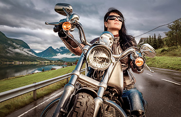 Image showing Biker girl on a motorcycle