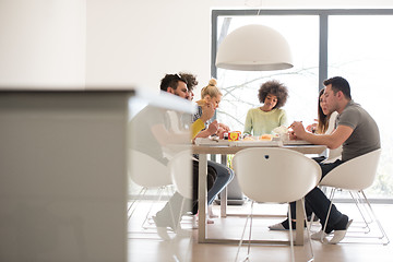 Image showing multiethnic group of happy friends lunch time