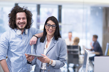 Image showing Business People Working With Tablet in startup office