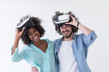 Image showing multiethnic couple getting experience using VR headset glasses