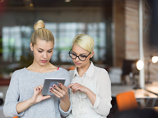 Image showing Pretty Businesswomen Using Tablet In Office Building during conf