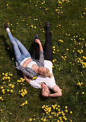 Image showing man and woman lying on the grass