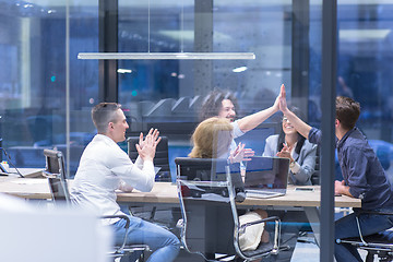 Image showing startup Group of young business people celebrating success