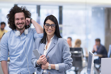 Image showing Business People Working With Tablet in startup office