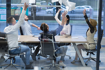 Image showing startup Group of young business people throwing documents